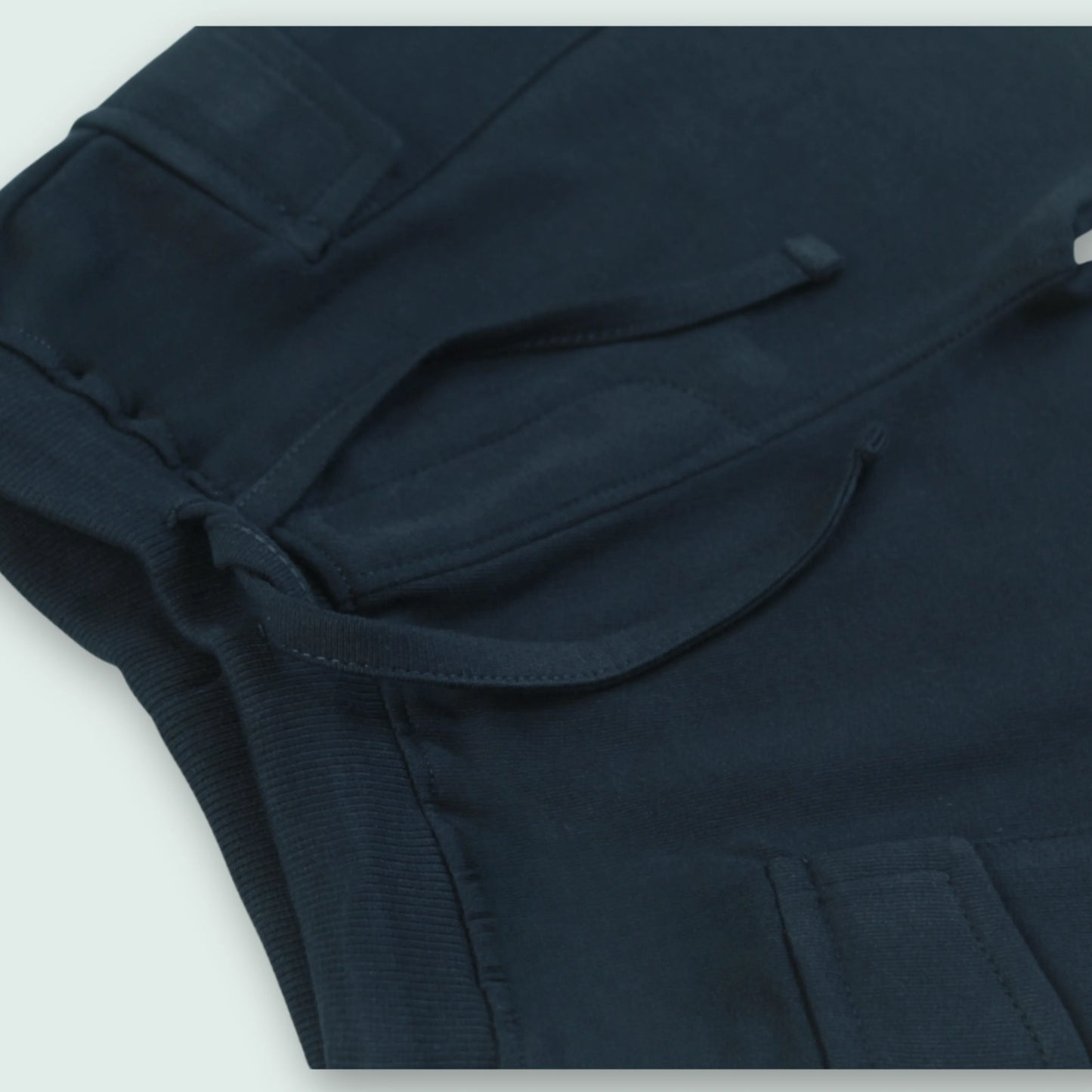 Close-up of elastic waistband on navy cotton shorts – comfortable and secure fit baby clothes for boys from Littleseeds™