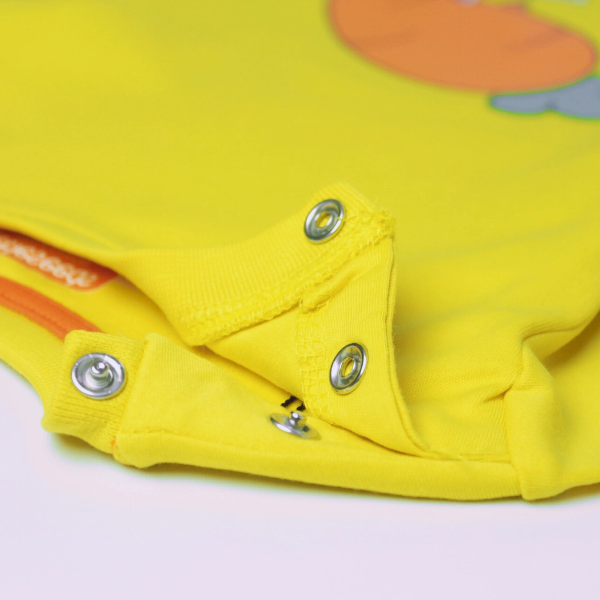 Close-up view of baby boys cotton T-shirt in yellow with cute rabbit design – breathable and gentle on skin