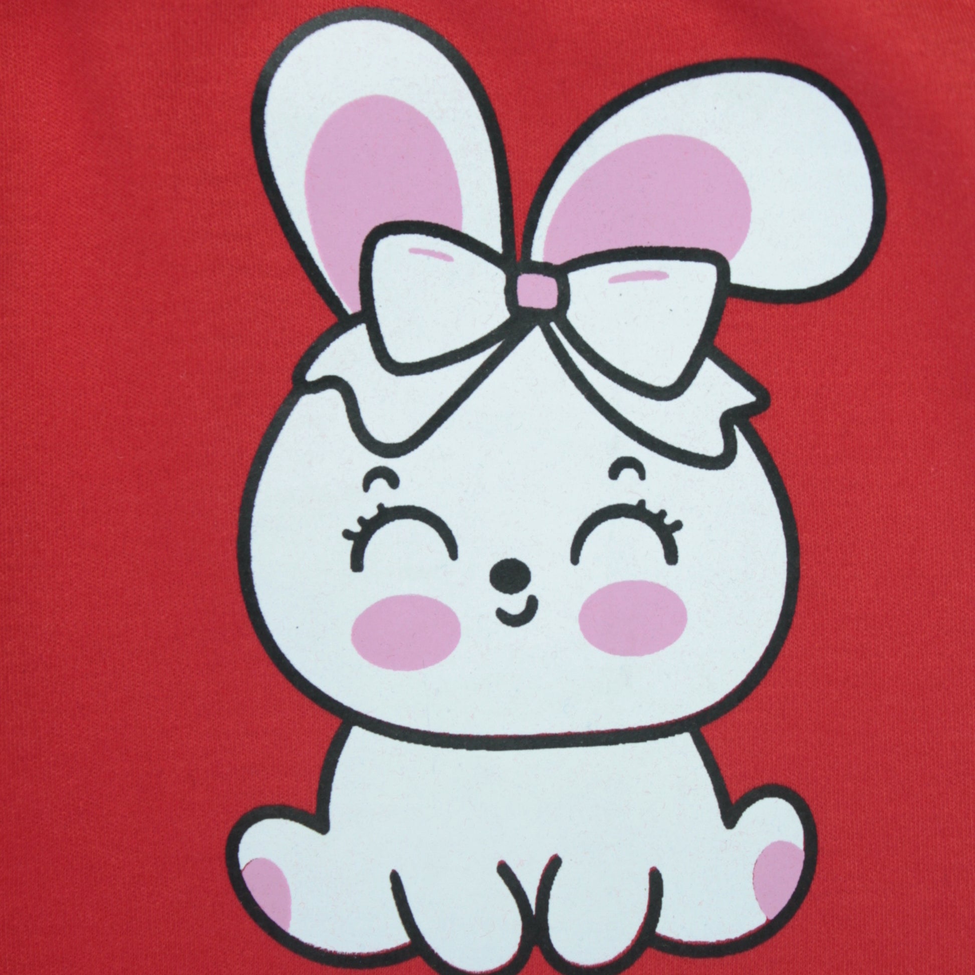 Close-up of rabbit print and fabric texture on red cotton joggers – premium quality baby clothes for girls