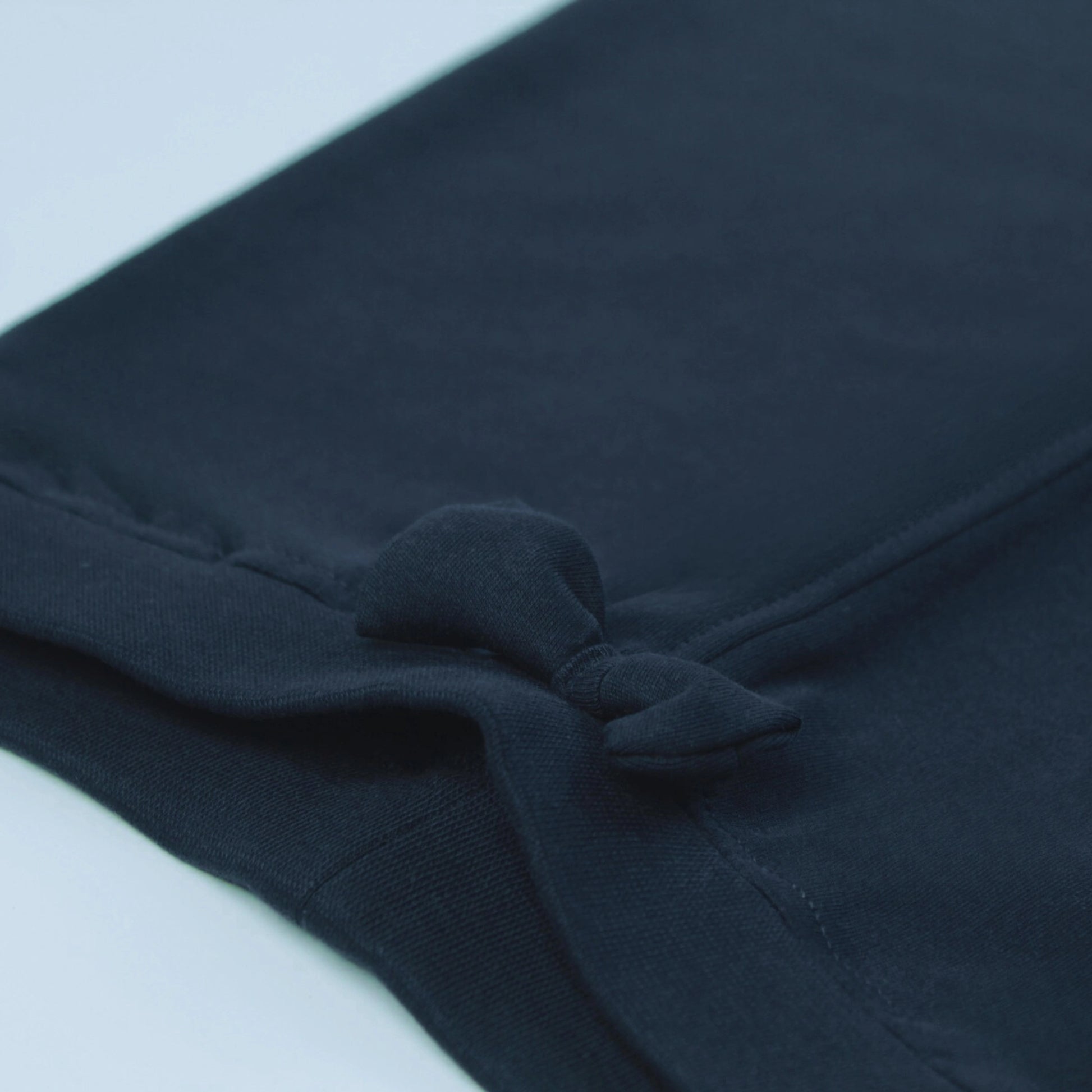 Detailed view of stitching and elastic waistband on navy cotton joggers – stylish and durable baby clothes for girls