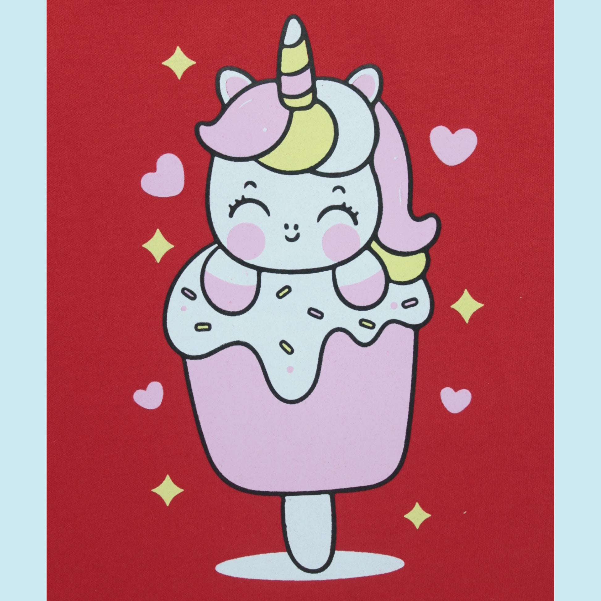 Close-up view of unicorn placement print on red cotton T-shirt – cute and playful baby clothes for girls.