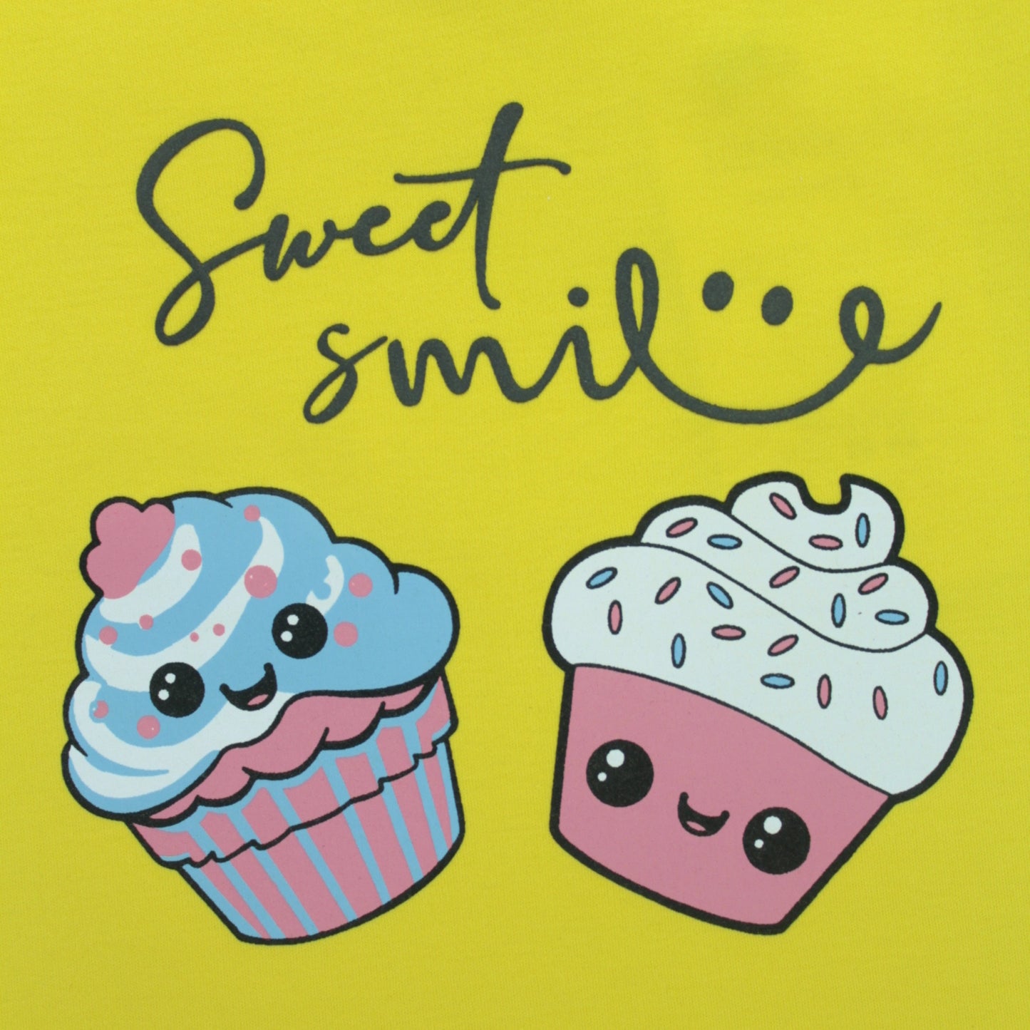 Detailed view of premium cotton fabric and stitching on yellow cupcake print T-shirt – high-quality baby clothes for girls.