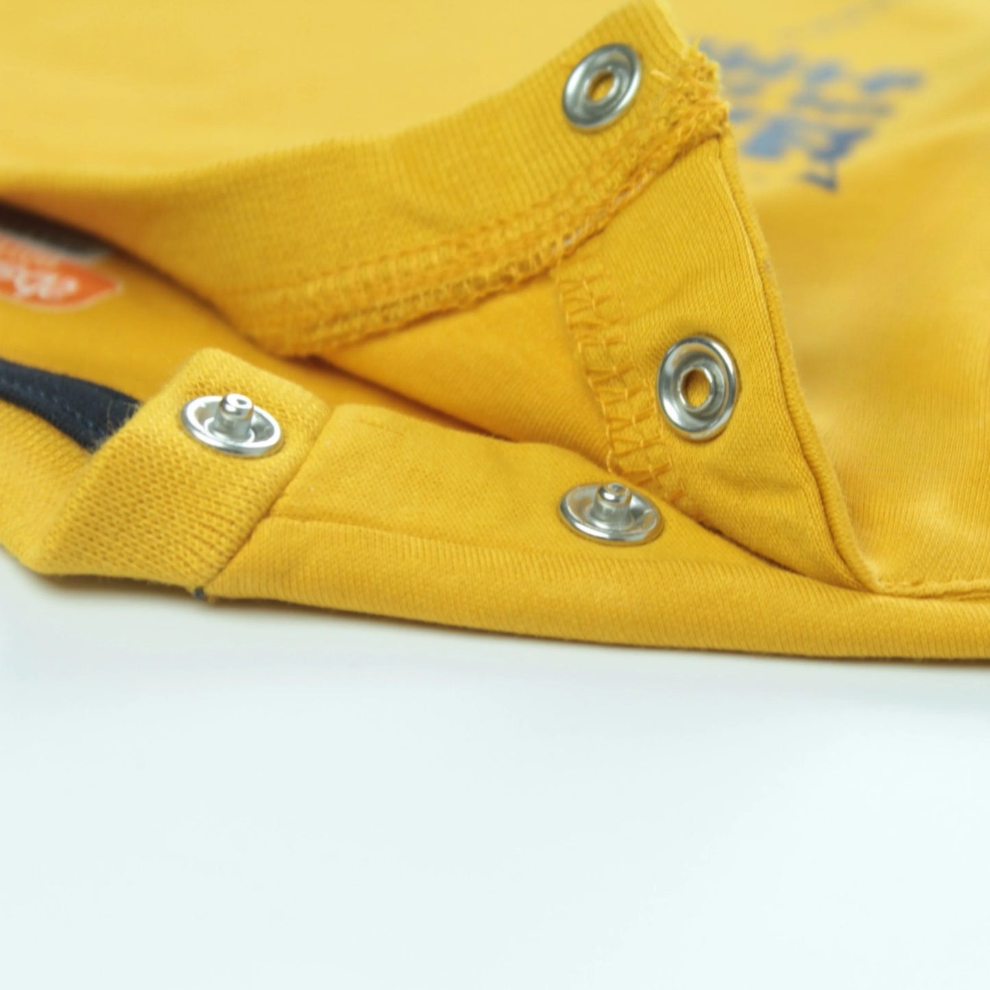 Infant boy wearing golden astronaut print T-shirt – stylish and comfortable clothing for infant by Littleseeds™.