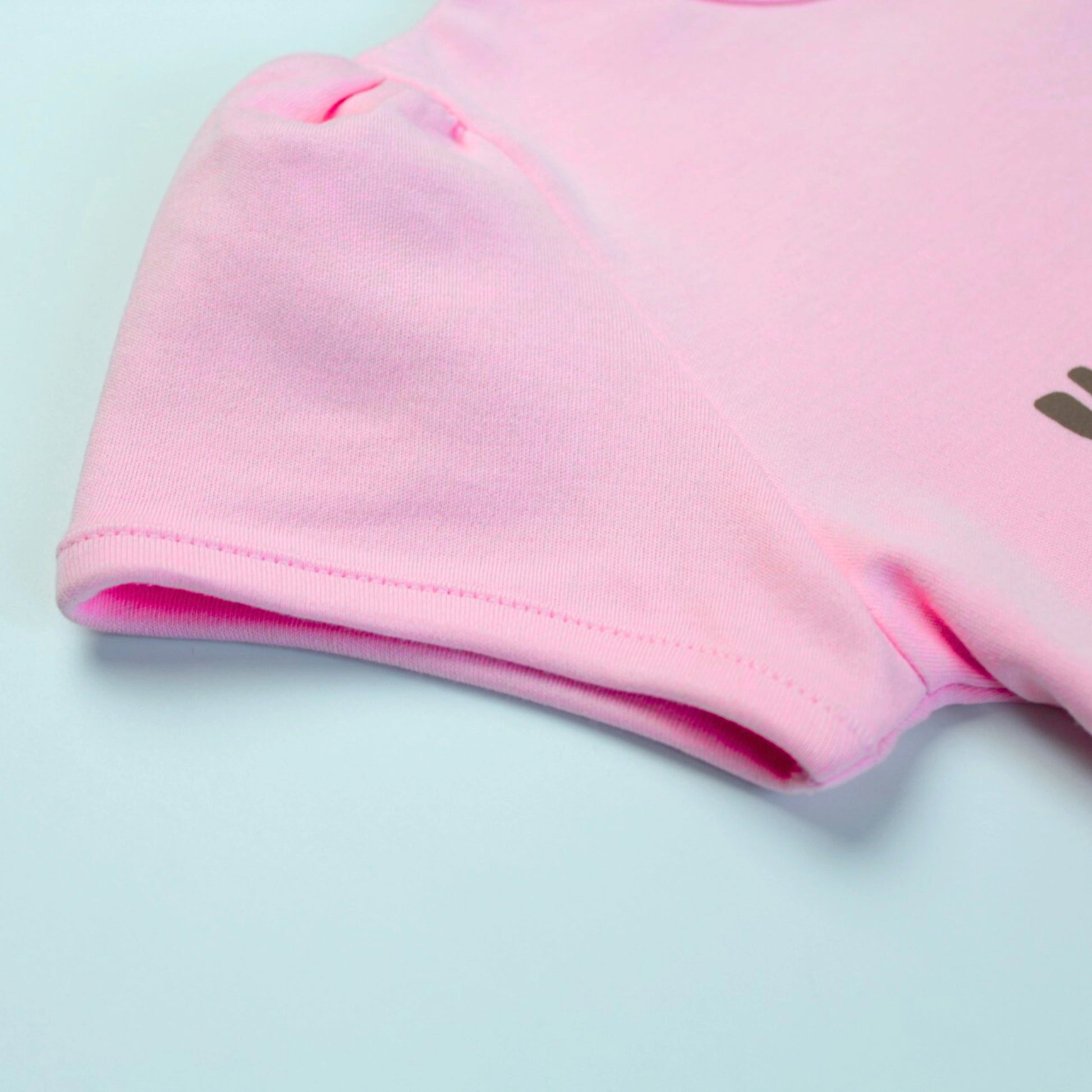Detailed fabric and stitching view of soft cotton puff sleeve T-shirt – quality girlish clothing for kids