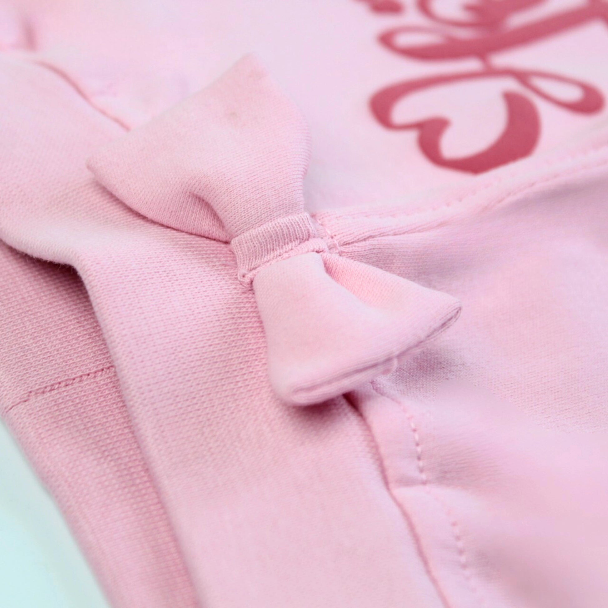 Detailed view of stitching and soft cotton fabric on pink girls joggers – durable and comfortable design