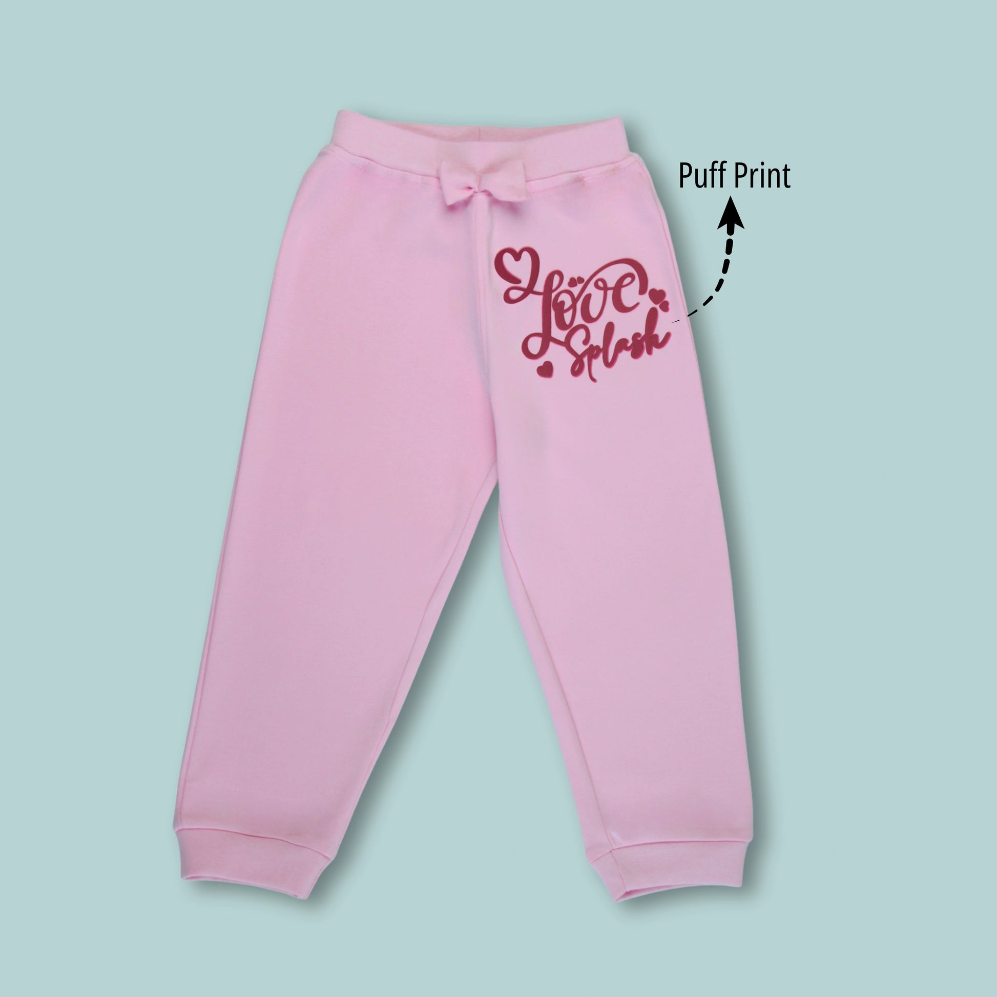 Front view of pink girls joggers with butterfly and text print – comfortable cotton joggers for active kids