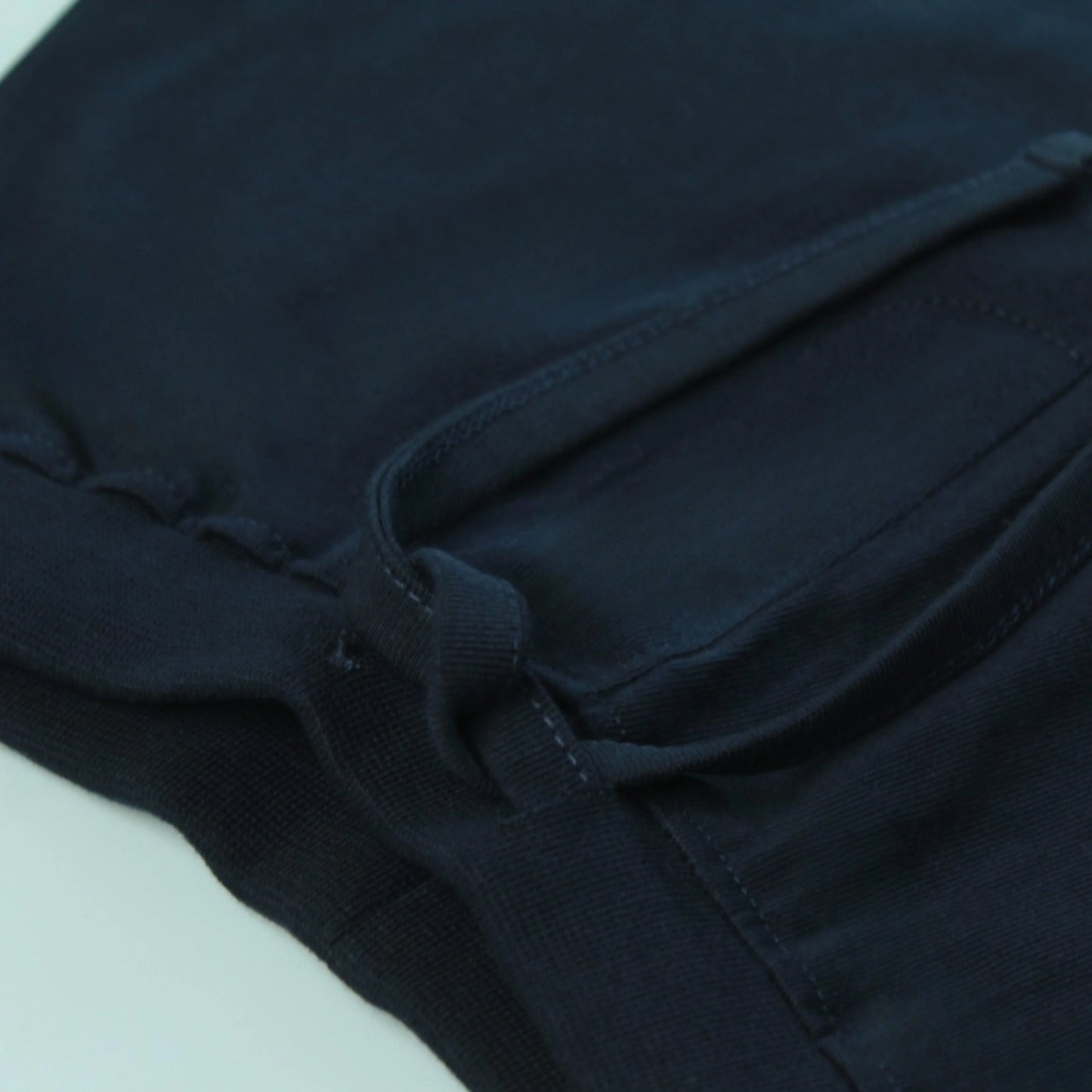 Detailed view of soft stretchable waist elastic on navy shorts for infants – designed for comfort and easy movement