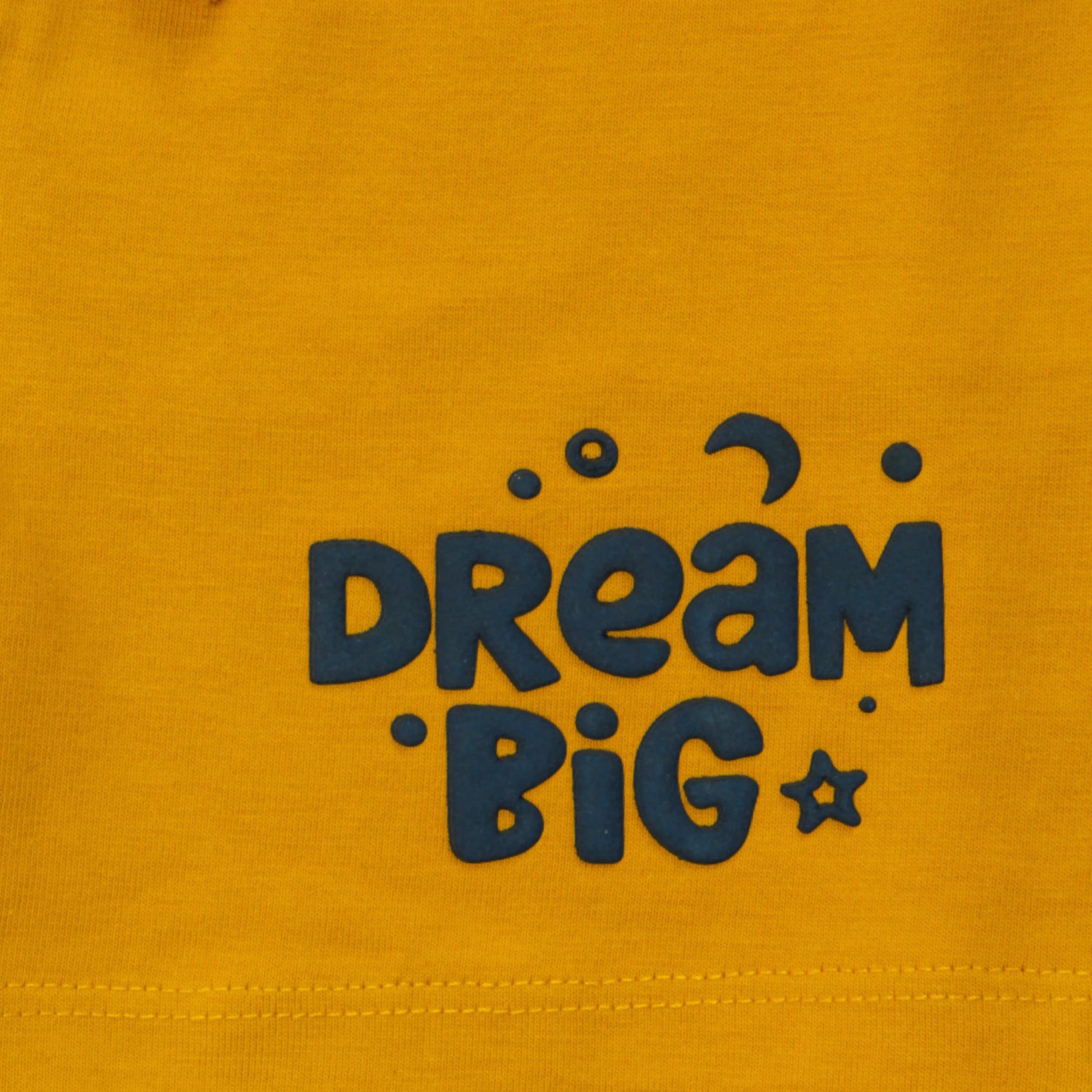 Close-up of yellow cotton shorts for infants showing premium stitching, fabric quality, and playful detailing