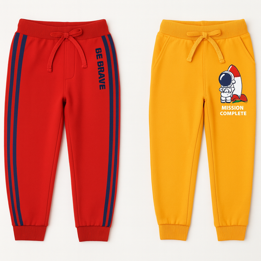 Red and yellow children's jogger pants with motivational text and graphics on a white background