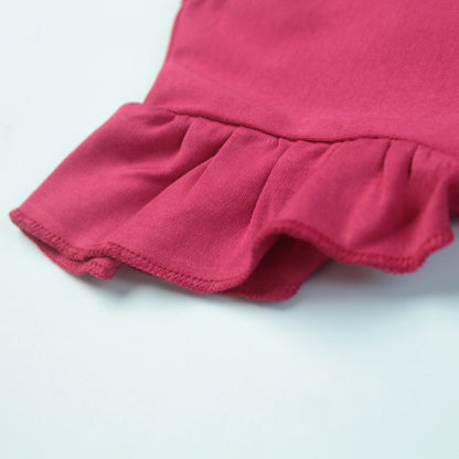 Close-up of adorable elephant placement print on dark pink cotton T-shirt – cute and playful baby clothes for girls.