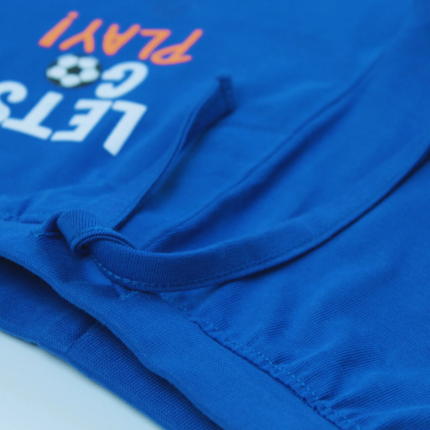 Boys' clothing – Side view of royal blue cotton shorts with bold text print, designed by Littleseeds™.