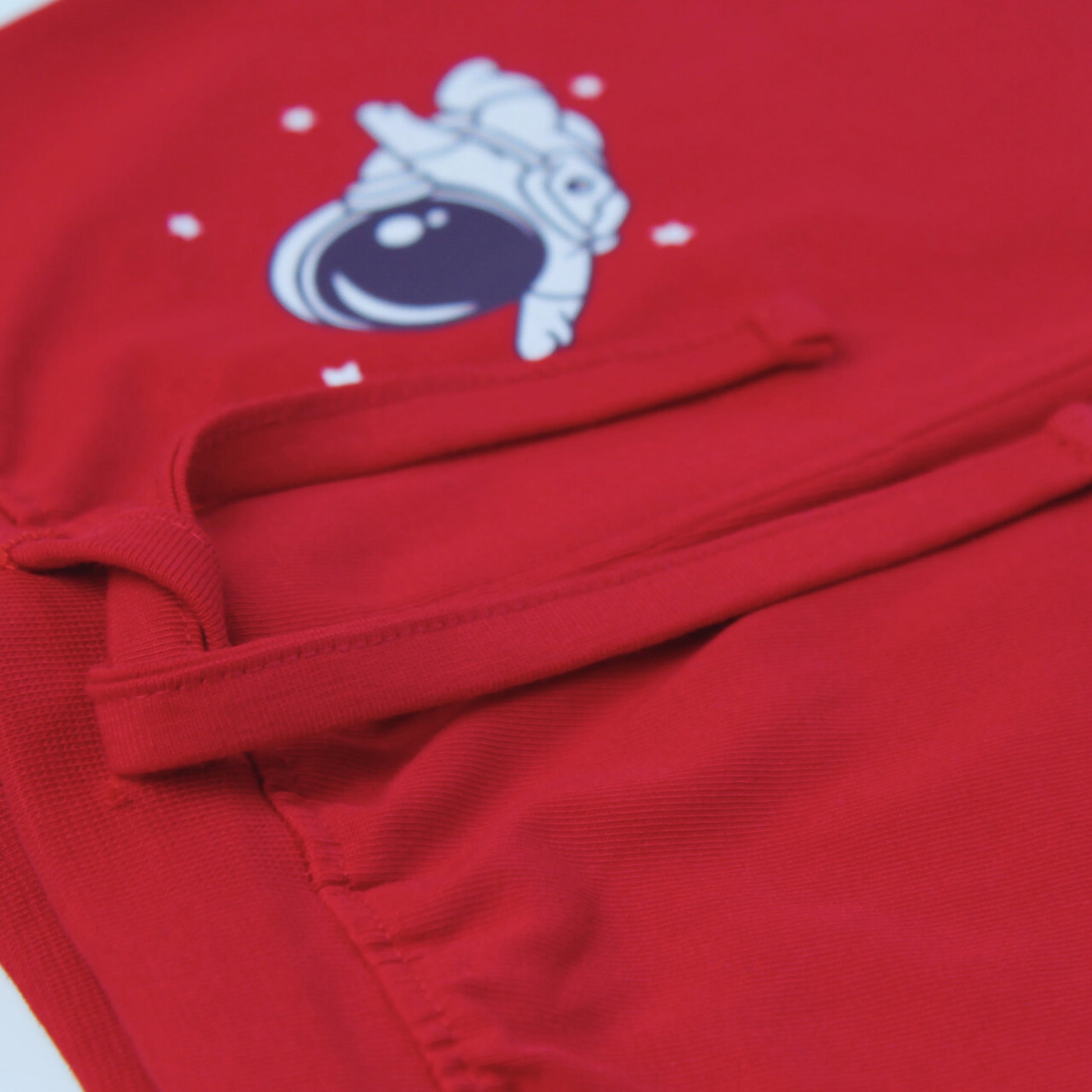 Boys' clothing – side view of soft cotton red shorts featuring astronaut design for toddlers