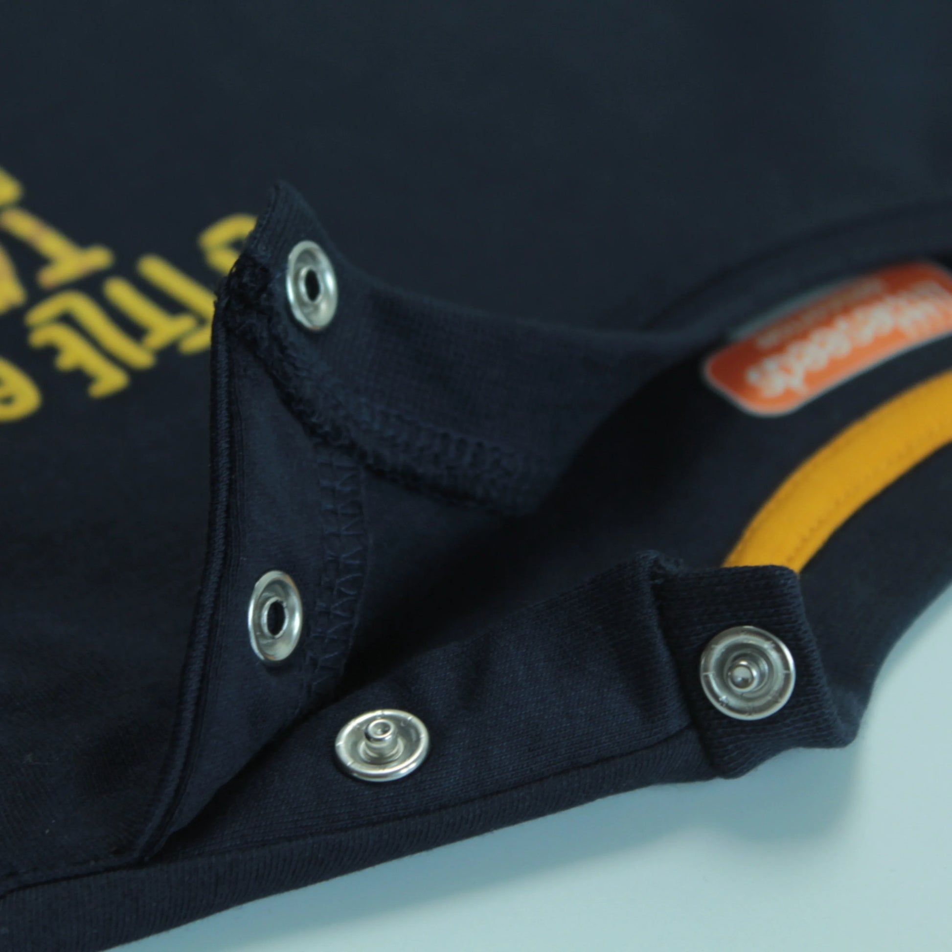 Close-up of navy childrens t shirt showing high-quality giraffe print and soft breathable cotton fabric for infants