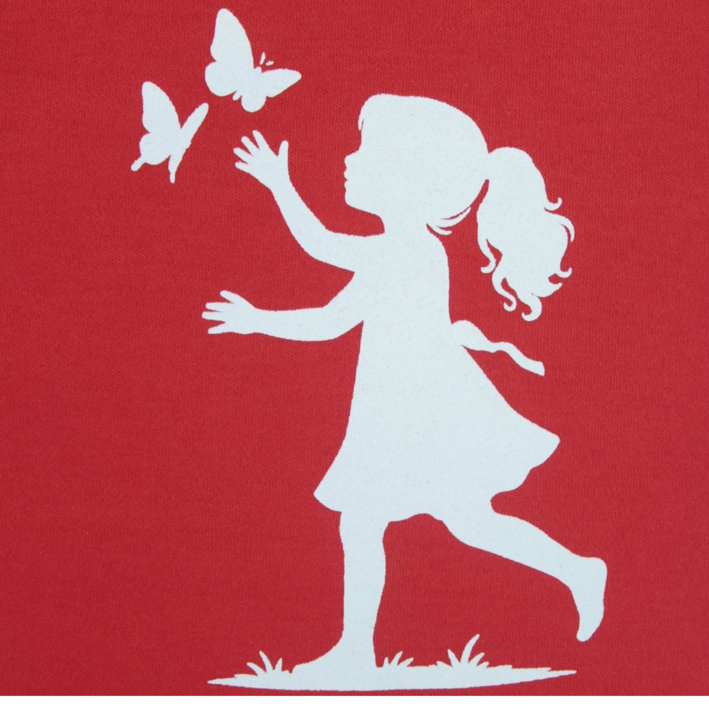 Close-up of girl baby print on red cotton joggers – soft and trendy girlish outfits for toddlers and kids