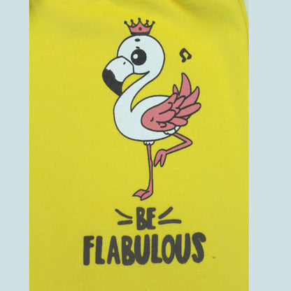 Closeup of flamingo print detailing on soft cotton girls joggers – premium quality girlish outfits in bright yellow.
