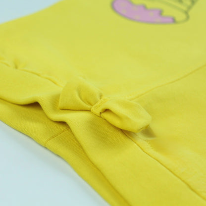 Close-up of waistband and fabric texture on yellow cotton jogger pants – soft and durable girlish outfits nightwear.
