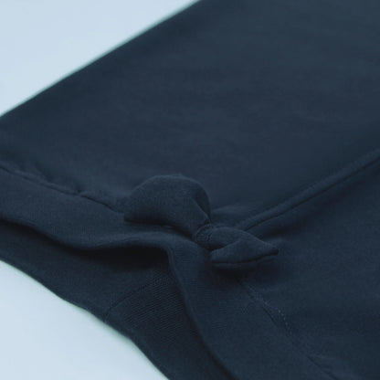 Detailed view of fabric quality and stitching on navy girls joggers – durable cotton construction with a smooth finish.