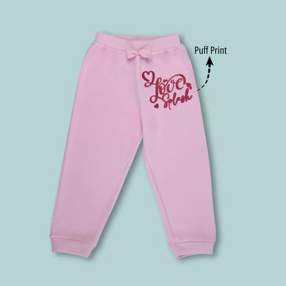 Front view of pink girls joggers with butterfly and text print – comfortable cotton joggers for active kids