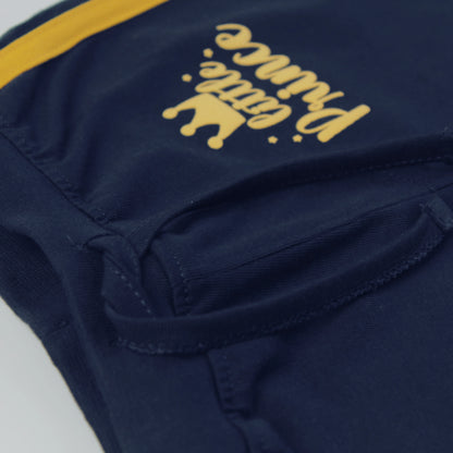 Side view of infants shorts in navy blue – soft 100% cotton fabric with tape detailing for comfort and durability, Littleseeds™ kidswear.