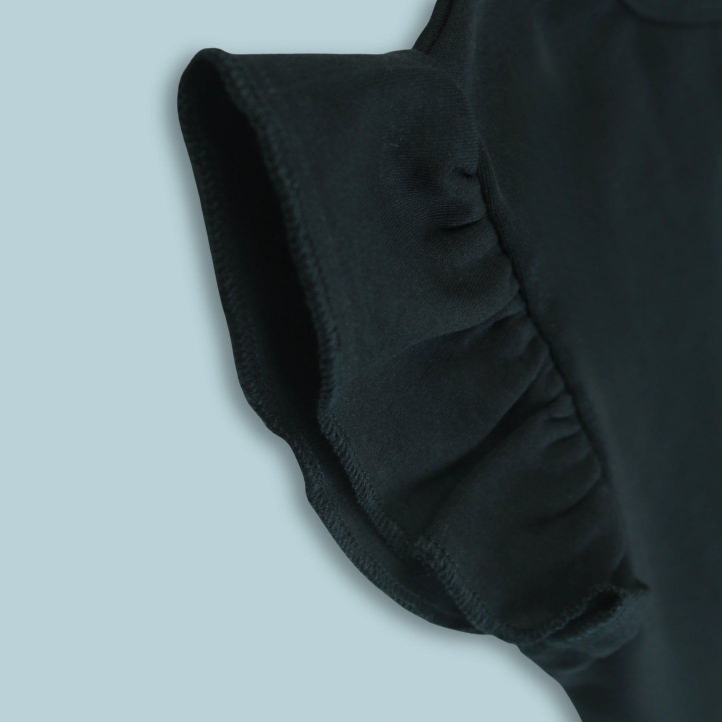 Fabric and stitching detail of black cotton puff sleeve T-shirt – soft, durable, and premium quality latest girlish dresses.