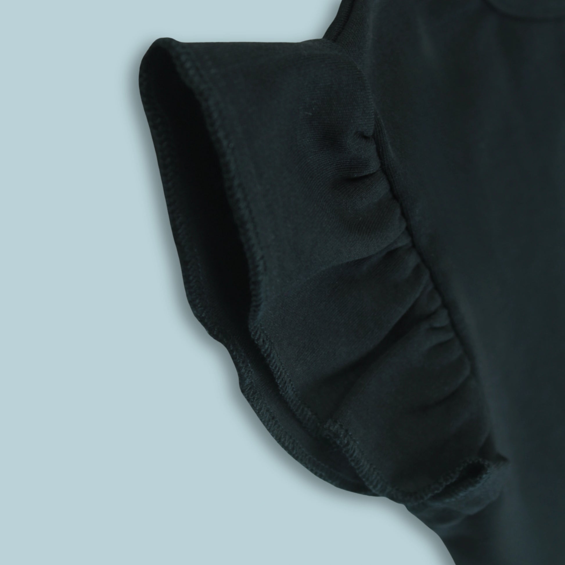 Fabric and stitching detail of black cotton puff sleeve T-shirt – soft, durable, and premium quality latest girlish dresses.