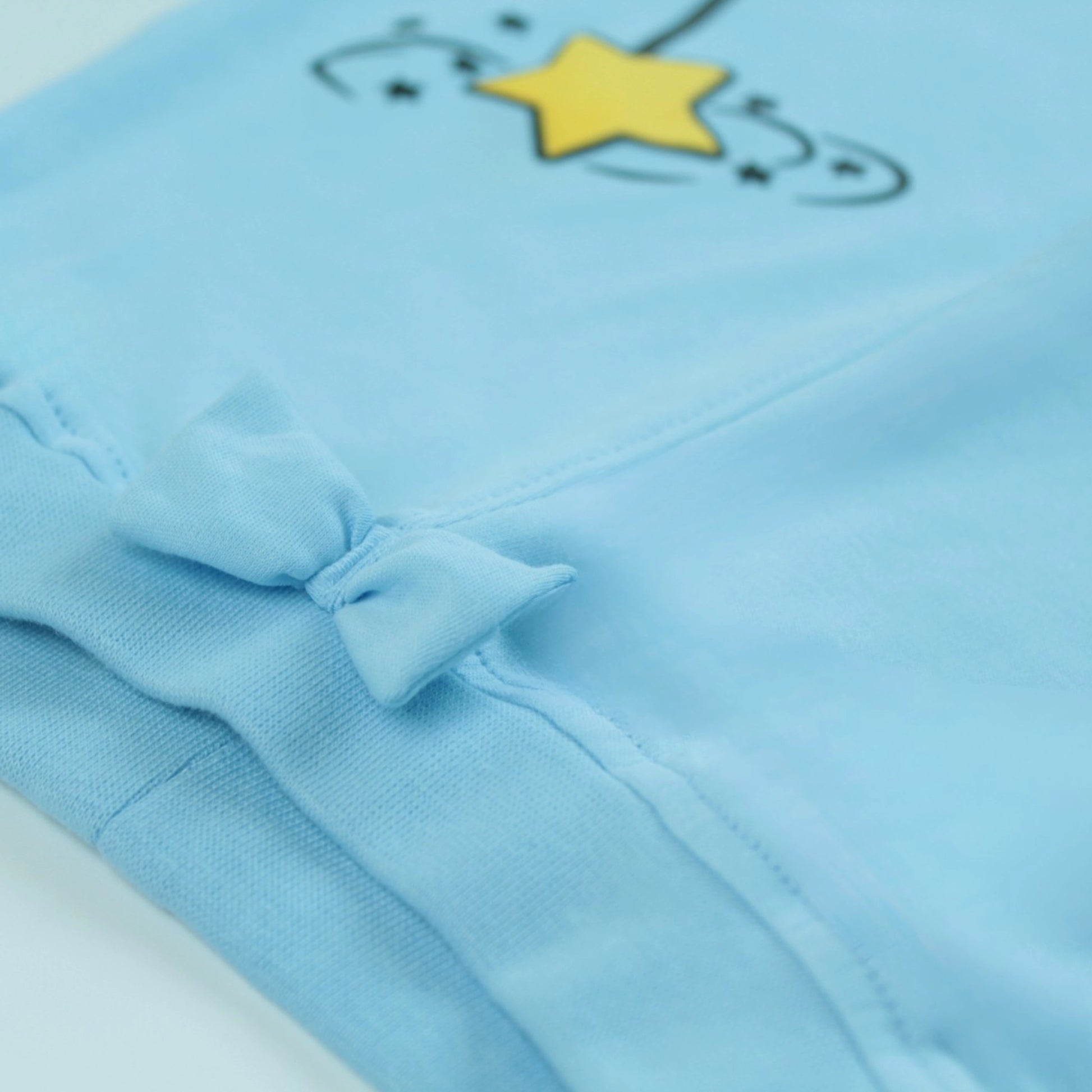 Close-up of waistband and stitching details on light blue cotton night suit pants – soft and durable design from latest girlish dresses.