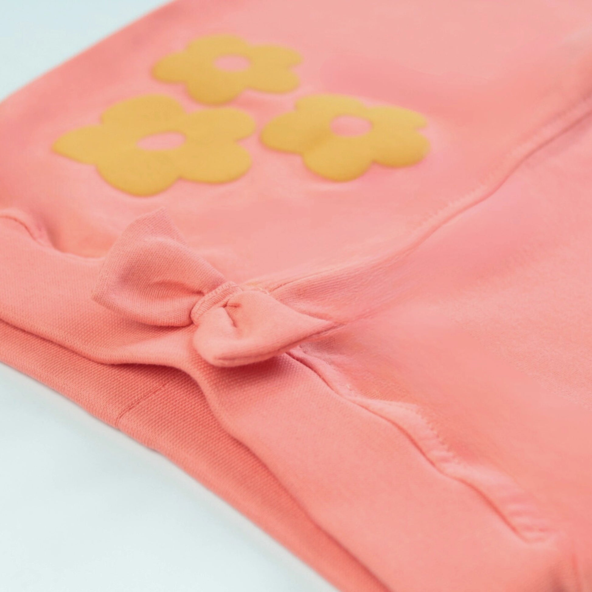 Close-up of waistband and stitching details on coral red cotton jogger pant – premium quality night dress for childrens.