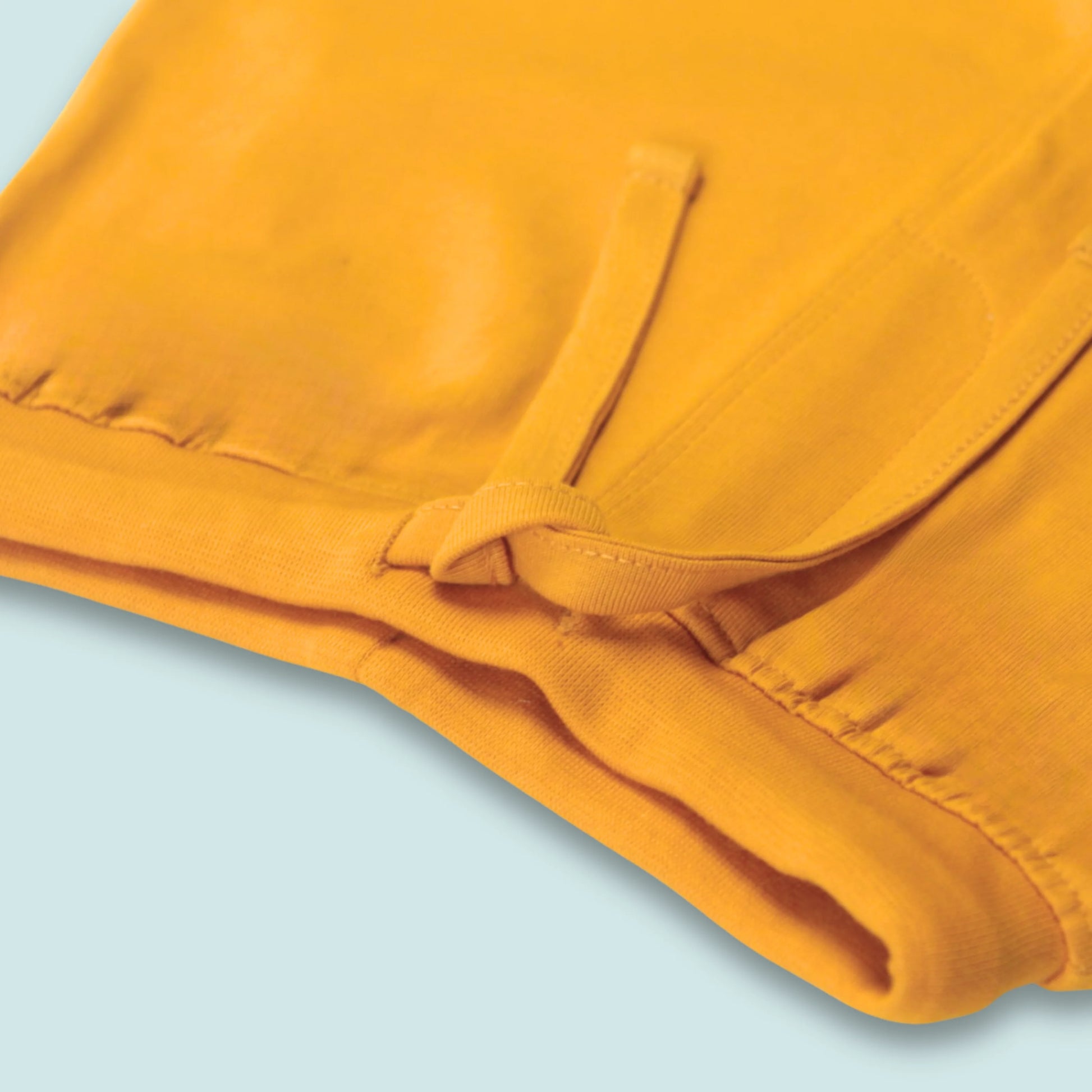 Elastic waistband detail of soft cotton yellow shorts for infants – gentle, stretchable, and designed for all-day comfort